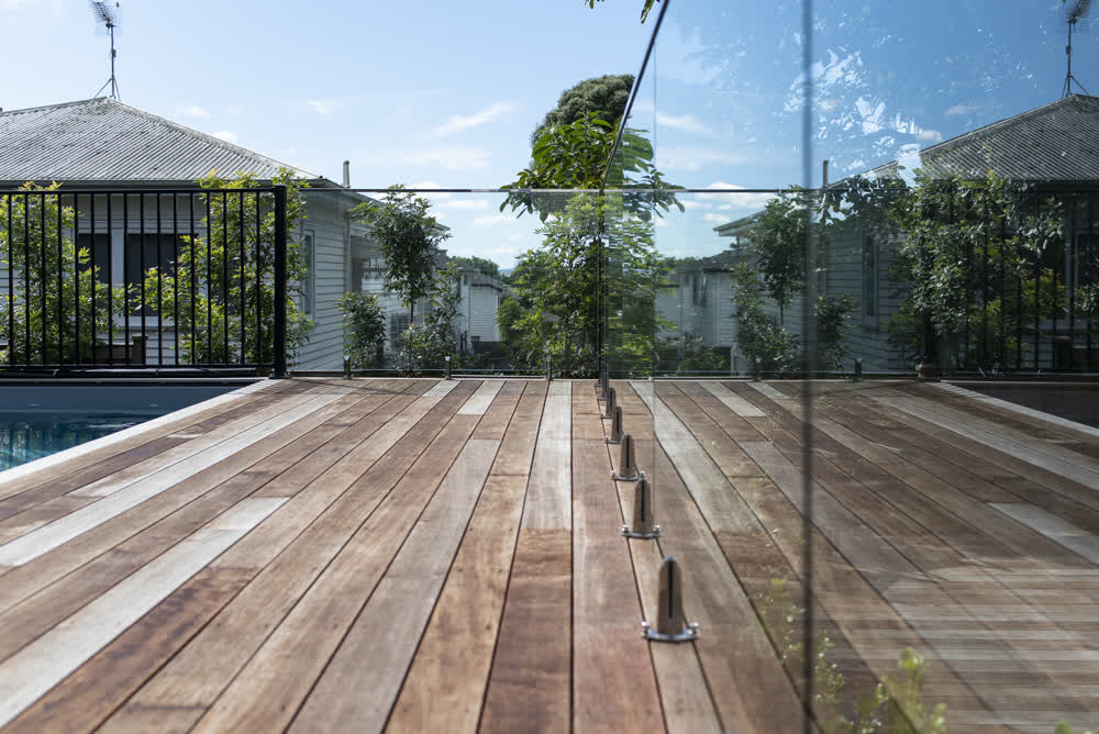Glass balustrade around decked pool area